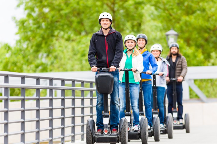 a group of people riding on the back of a pickup truck