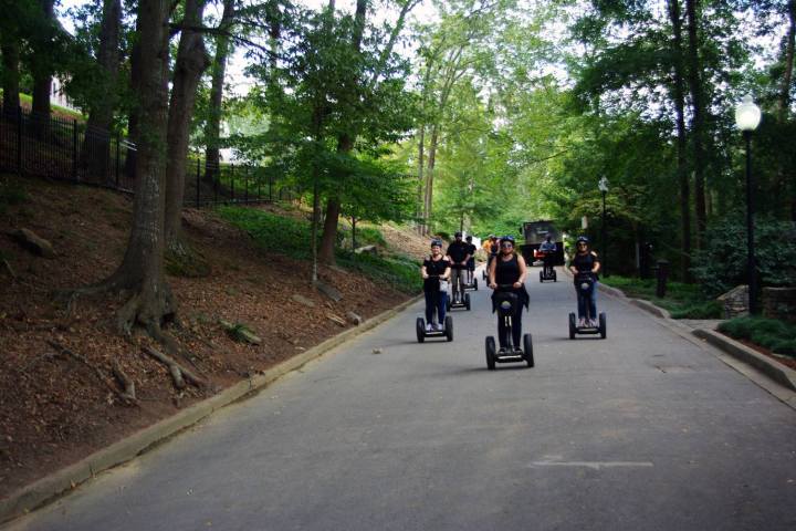 a group of people riding bikes down a street