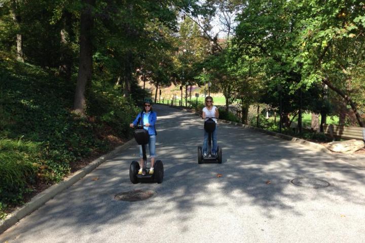 a man riding a motorcycle down a road