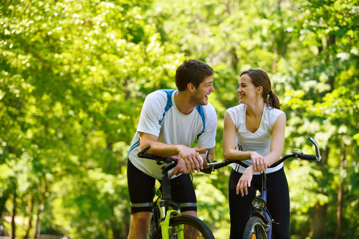 sh8-7060-451-1 a man and a woman holding a bicycle