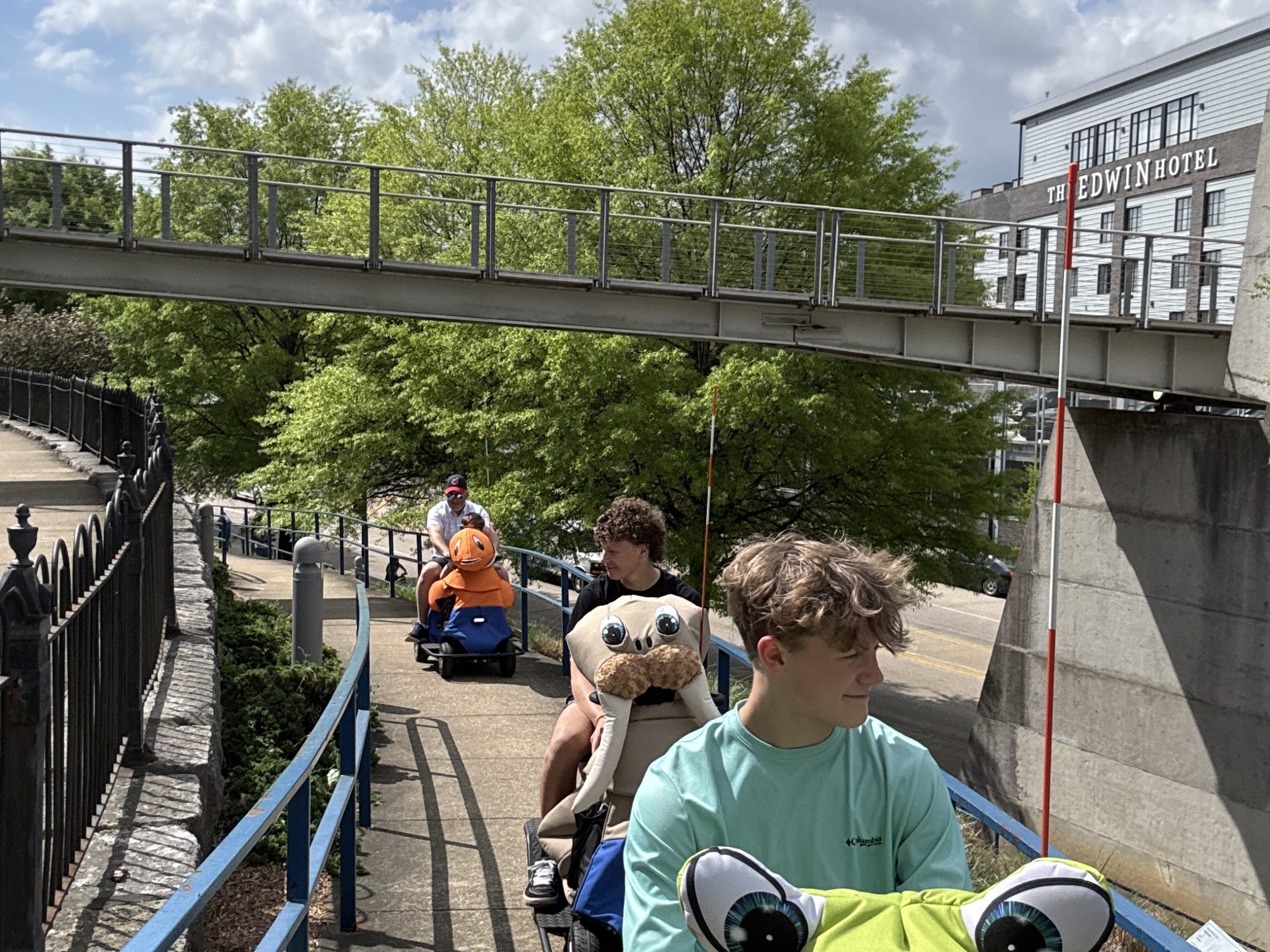 a group of people walking on a bridge