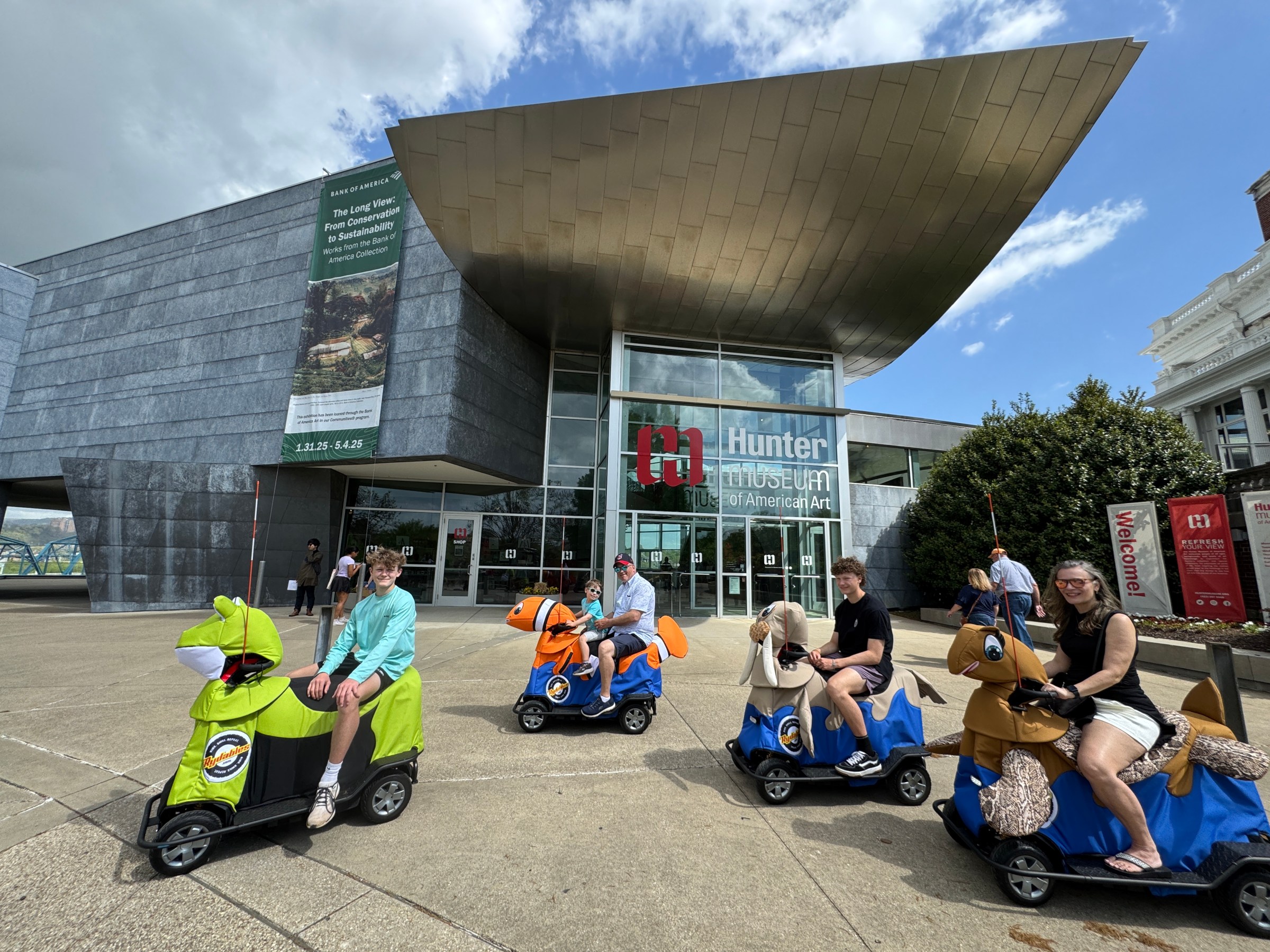 a group of people sitting in front of a building
