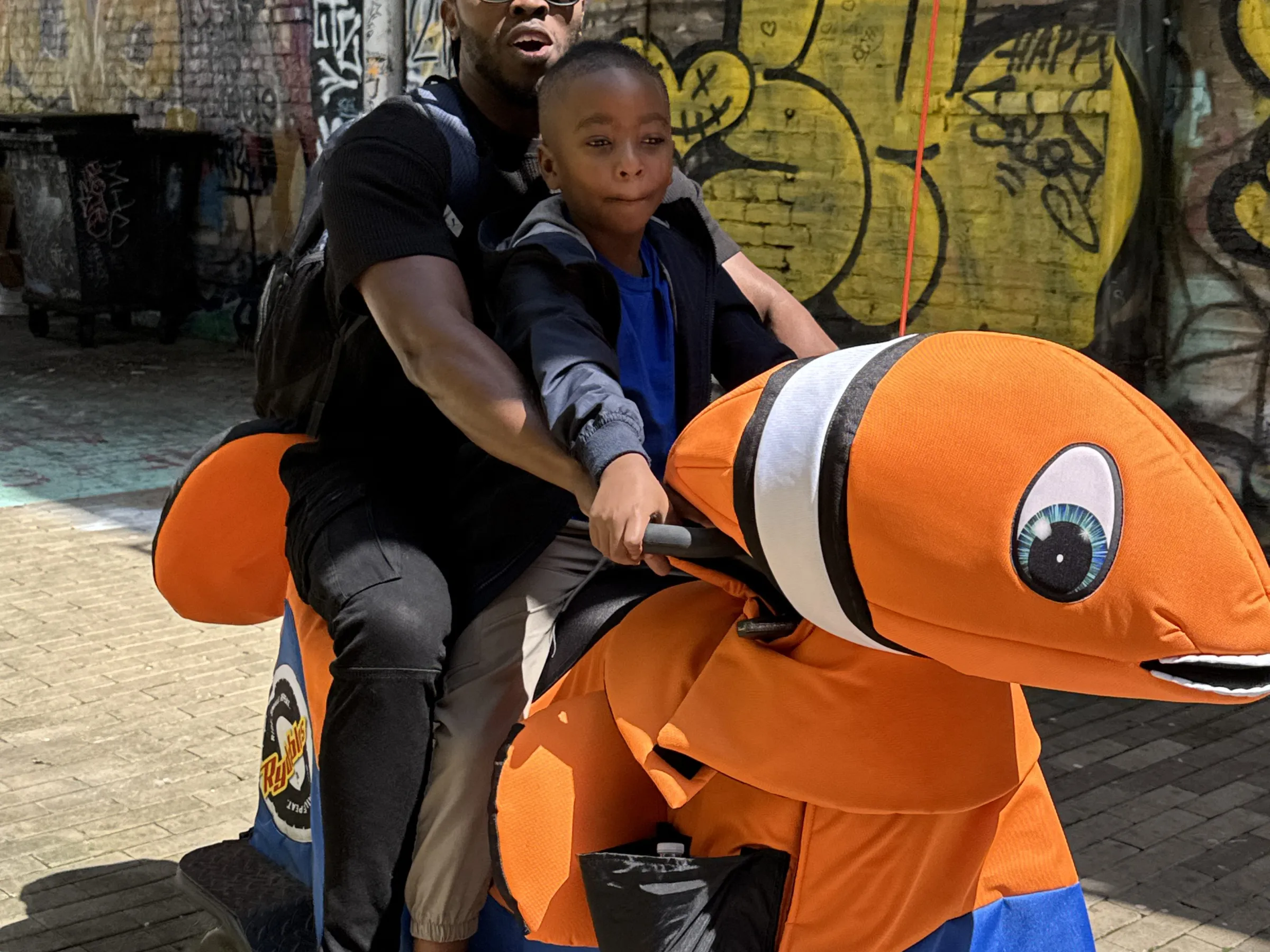 a man and a woman sitting on a bench