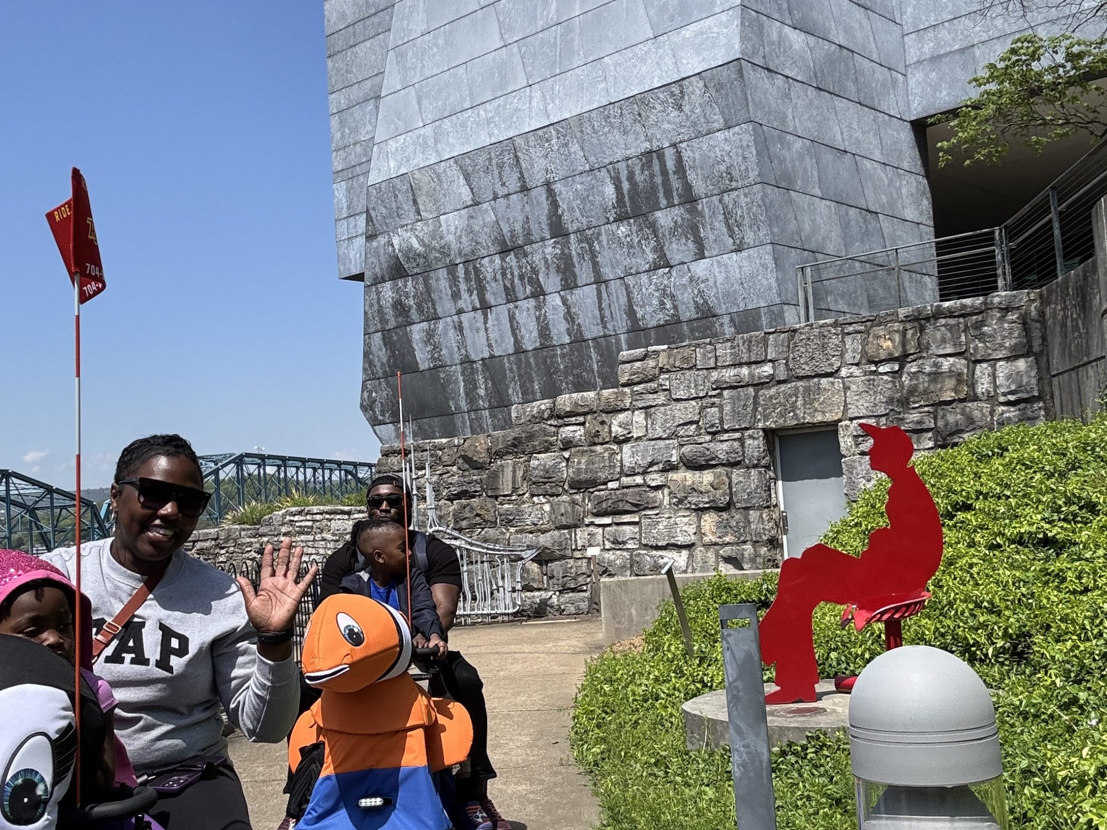 a group of people standing in front of a building