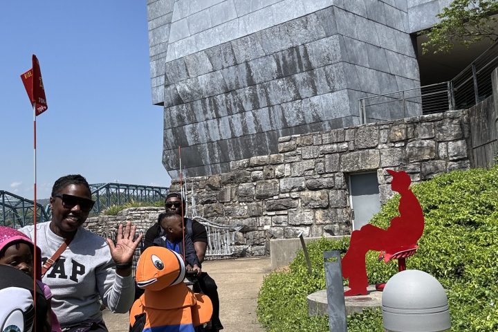 a group of people standing in front of a building