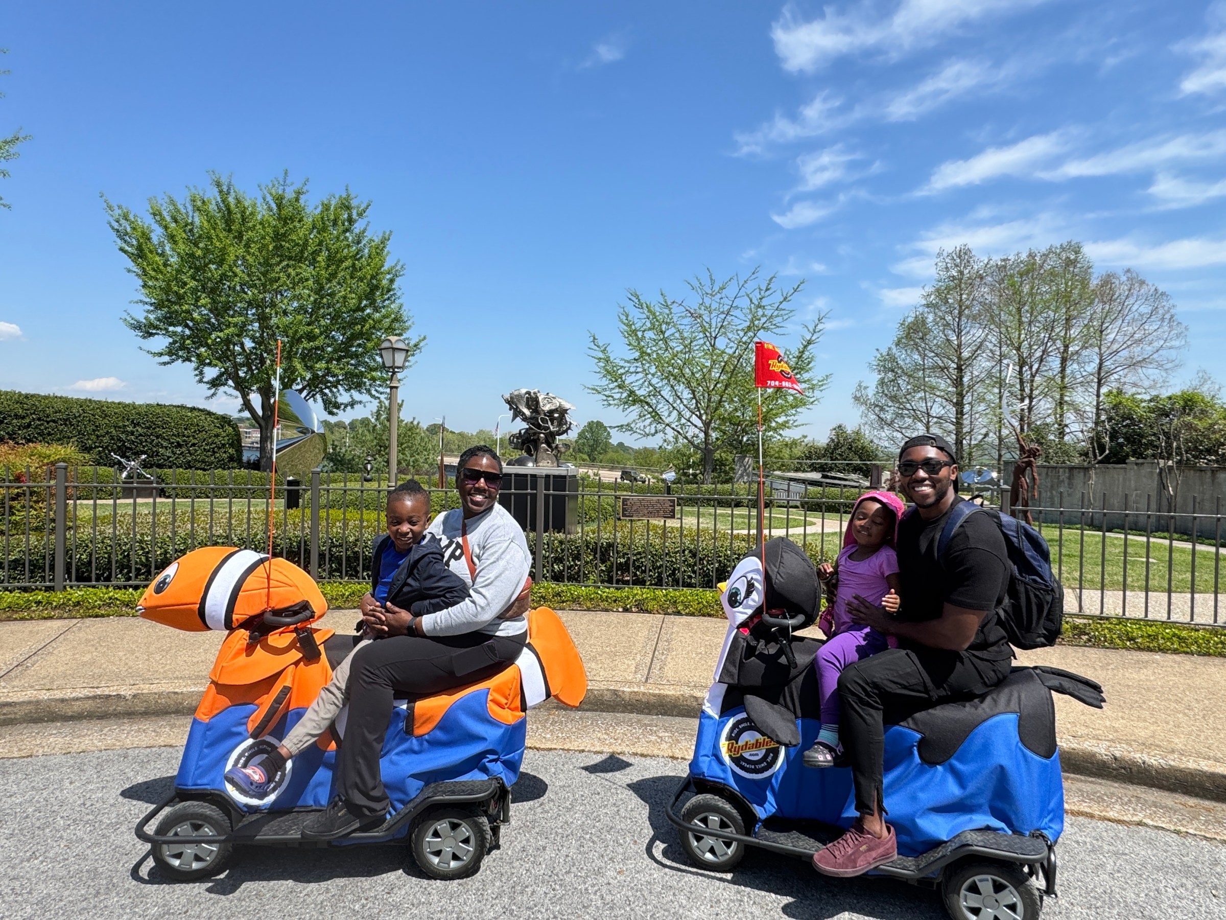 a group of people riding on the back of a motorcycle